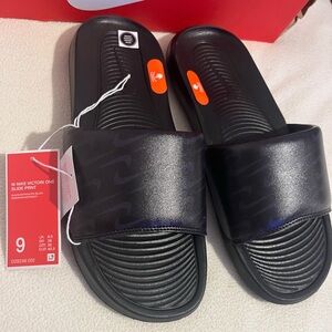 Nike Black Slides with Subtle Logo Pattern